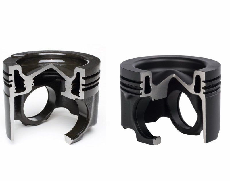 Two steel pistons, cut open and positioned next to each other, show their internal structure and the shape for high-performance applications. 